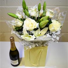 A White Roses and Lilies Handtied with Prosecco