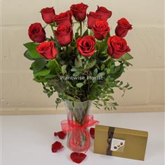 A Valentines Day Luxury Red Roses In Vase With Chocolates
