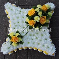 Based Cushion Wreath with a Ribbon Edge