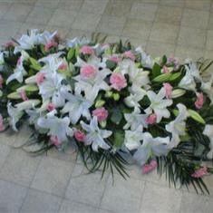 A Lily And Carnation Coffin Oasis Spray