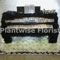 Electric Piano Made In Flowers For A Funeral