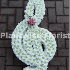 G Clef Musical Note Made In Flowers For A Funeral