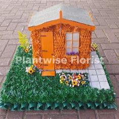 Garden Shed With Garden Scene Made In Flowers for A Funeral