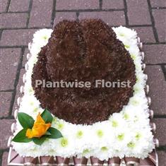 A Trilby Hat Wreath Made In Flowers For A Funeral