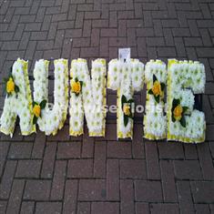7 AUNTIE Letter Wreath Made In Flowers with Single Flower