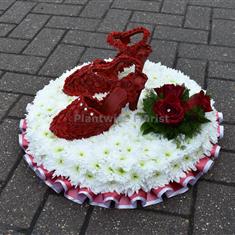 A Pair of Red Shoes Made in Flowers For Funeral