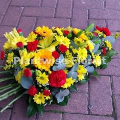 Germini and Lily Funeral Oasis Spray in Red and Yellow