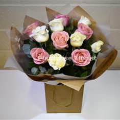 A Valentine's Deluxe Mixed Pink and White Roses Handtied 