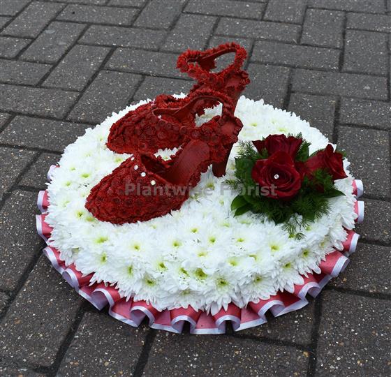 A Pair of Red Shoes Made in Flowers For Funeral